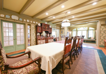 long antique table with antique chairs shown as space for having meetings at Stony Point Center