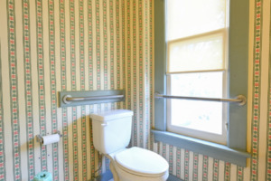 shows toilet with grab bars - a sample ADA adjacent bathroom in Gilmor Sloane House at Stony Point Center
